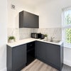 Photo 3: Fridge freezer, toaster, kettle, microwave 