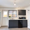 Photo 5: Fridge freezer, toaster, kettle, microwave 