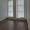 Photo 5: Living Space with Vertical Blinds