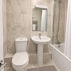 Photo 4: Bathroom with tub