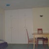 Photo 5: Large living room. Overspill spare wardrobes