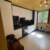Photo 5: Kitchen inc washing machine and dishwasher 