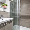 Photo 2: The washroom is nice and clean with storage under the basin