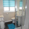 Photo 3: Shares a clean and modern bathroom with just one other person