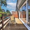 Photo 5: Outdoor balcony with table and chairs