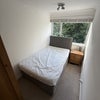 Photo 9: Room 2 zoomed out, with small double, bedside cabinet and wardrobe