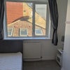 Photo 9: Bedroom — window and fireplace side