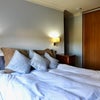 Photo 3: King Size bed by built in Wardobes