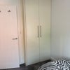 Photo 2: Floor-to-ceiling double built-in wardrobe offering great storage
