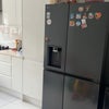 Photo 4: Fridge, with microwave inside cupboard