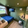 Photo 5: Bedroom with colour tv
