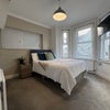 Photo 2: Bright bay window room