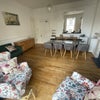 Photo 1: Large Living room - High ceilings with full height windows with oblique sea views
