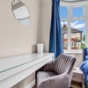 Photo 2: Bright, comfortable bedroom with dedicated workspace and natural light