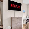Photo 4: Smart TV with Netflix access, storage and modern furnishings