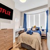 Photo 6: Fully furnished single bedroom with Smart TV, comfortable bed and natural light