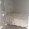 Photo 9: Double bed, 2 shelving units, storage under bed and clothes hanging rack