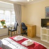 Photo 2: Bedroom with desk, TV & table & chairs