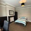 Photo 8: Long view of bedroom