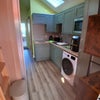 Photo 5: Fitted kitchen with washer dryer