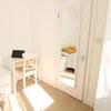 Photo 2: Comfortable bedroom with desk, wardrobe and storage