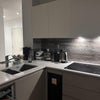 Photo 3: Kitchen: Bar seats, clean and modern finishing 