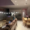 Photo 2: Living space with view of kitchen - on the left is a pantry area with fridge/washing machine/storage