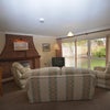 Photo 7: Sitting room with patio doors