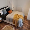 Photo 1: This Room 6 photo is enhanced by AI