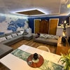 Photo 3: Living space with door to kitchen/laundry/storage on left and bathroom on right