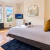 Photo 2: Spacious Double Bedroom With Mirrored Storage