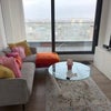 Photo 2: Living room with TV, sofa and balcony access 