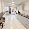 Photo 4: Sleek modern kitchen with free washing facilities