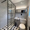 Photo 5: A bathroom with character: Victorian-style tiling meets modern fittings.