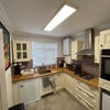 Photo 3: Solid oak worktops, integrated appliances and a dishwasher for the aftermath.