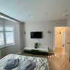 Photo 2: Smart TV, sleek storage and your own space to switch off.