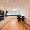 Photo 3: Eat-in-Kitchen with Modern Appliances