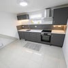 Photo 6: Kitchen with livng area / Hob / Extractor / Oven / Microwave / Fridge Freezer / Washer dryer