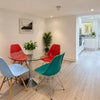 Photo 8: Dining area with wall mounted TV