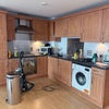 Photo 8: Kitchen area for reference of the space - we already added a dining table