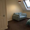 Photo 3: Double bedroom with sofa and skylights