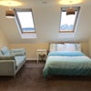 Photo 1: Double bedroom with sofa and skylights
