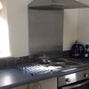 Photo 2: Kitchen with new appliances space for washing machine