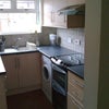 Photo 3: Offshot kitchen from dining room