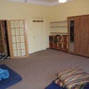 Photo 2:  bed/sitting room with kitchen door on left