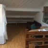 Photo 2: The desk/sofa area of the room