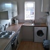 Photo 3: Kitchen with washer/dryer