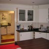 Photo 5: Kitchen with built in dish washer, fridge and then walk through to utility:washing machine & freezer