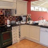 Photo 2: Kitchen leading into Conservatory