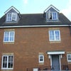 Photo 4: Front of house (room is top right)